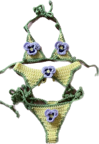 a crocheted bikini with flowers on it