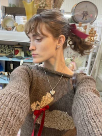 a woman is taking a selfie in a store