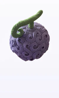 a crocheted purple grape with a green handle
